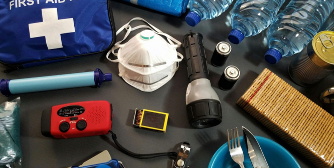 Tornado survival kit including emergency water bottles, canned food, first aid supplies, and portable power stations, ensuring preparedness during and after a disaster.